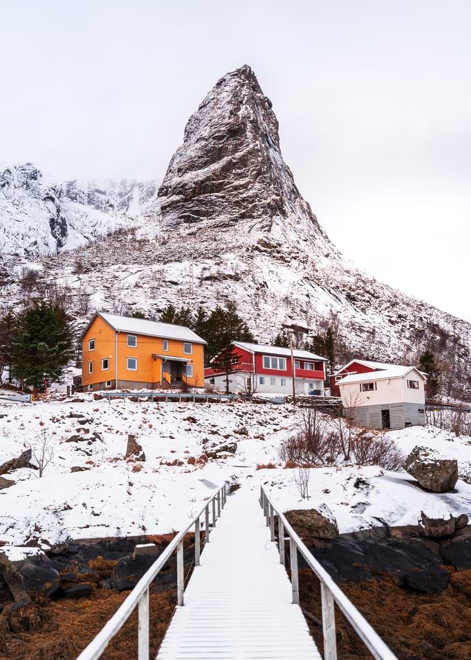 Snowy Norwegian Village with Mountain Peak