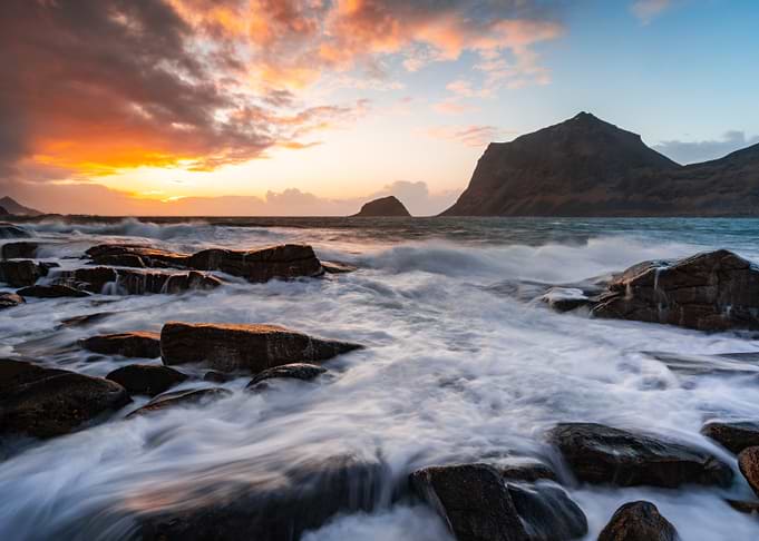 Dramatic Sunset Over Rocky Coastline