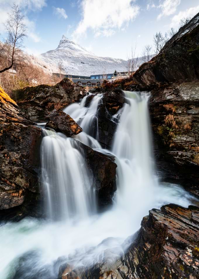 Majestic Waterfall in Snowy Mountains