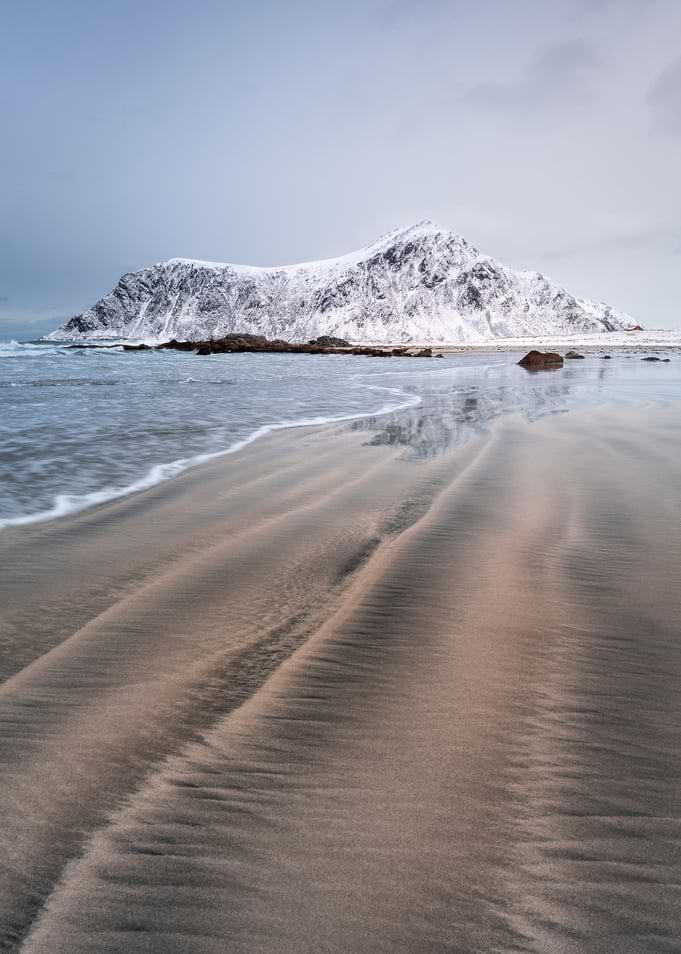 Snow-capped mountain beach landscape
