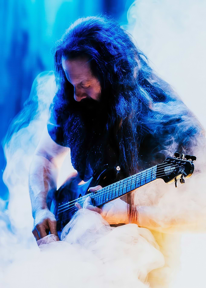 Guitarist playing on stage with smoke