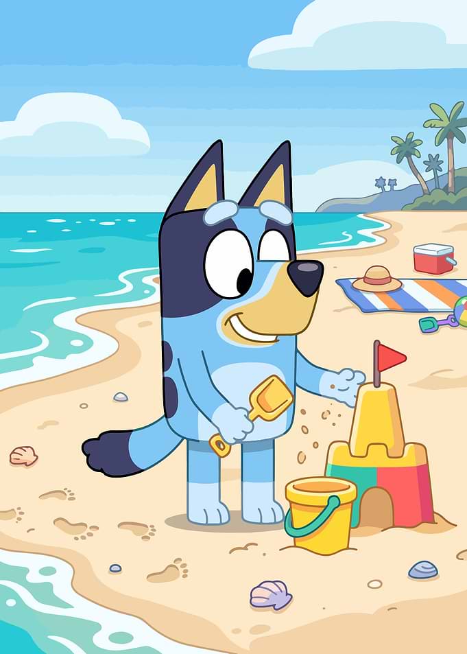 Bluey building a sandcastle at the beach