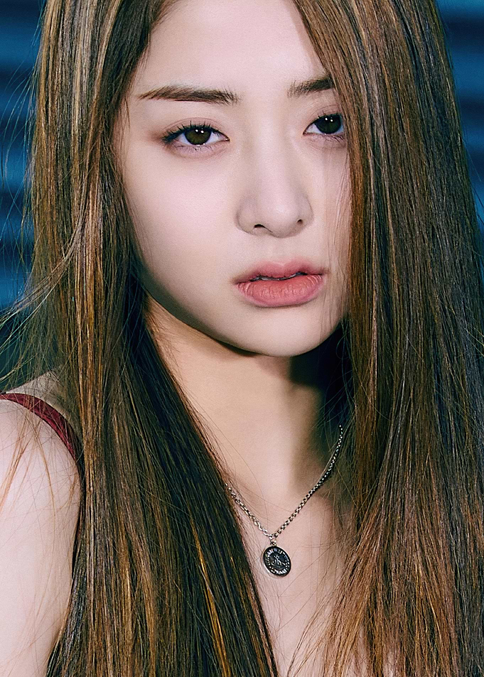 Close-up of Huh Yunjin with long brown hair