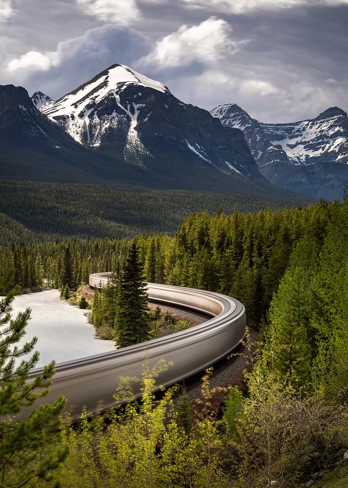 Train curving through a mountain landscape
