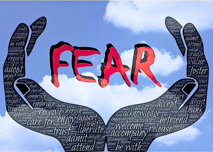 Hands holding the word FEAR
