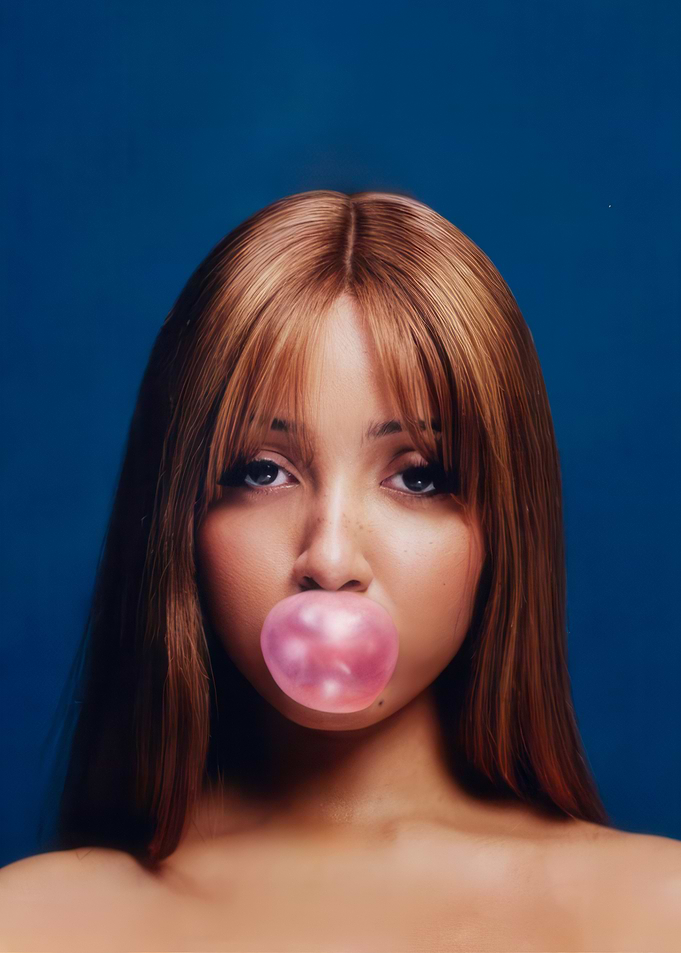 Woman blowing pink bubble gum