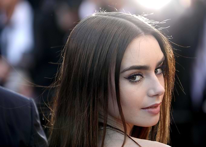Lily Collins looking over her shoulder