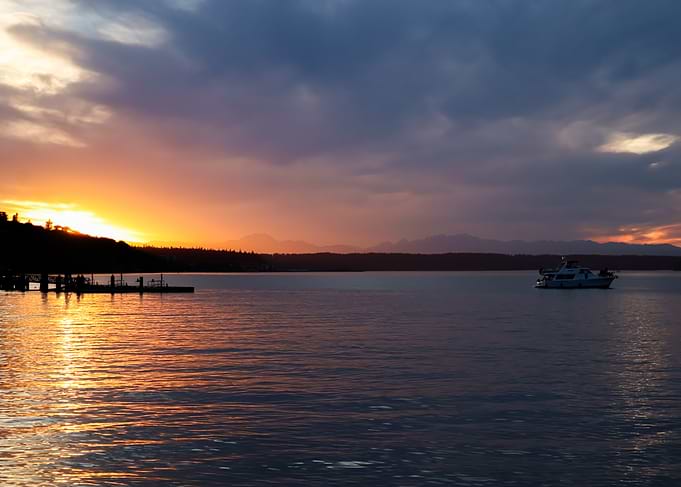 Summer Sunset With Boat on a calm evening bay