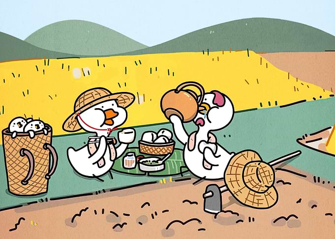 Cute ducks having a picnic