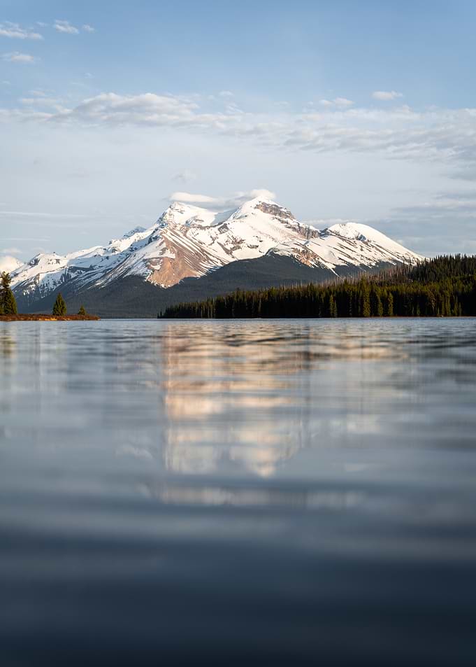 Snow-capped mountains reflected in a lake