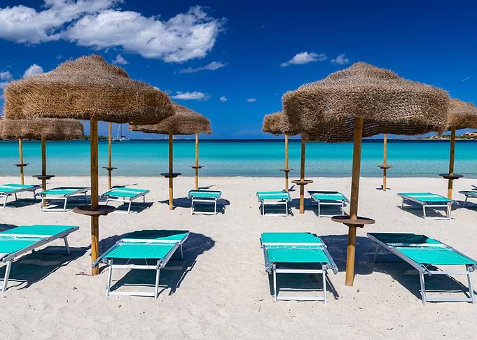 Tropical Beach with Umbrellas and Loungers