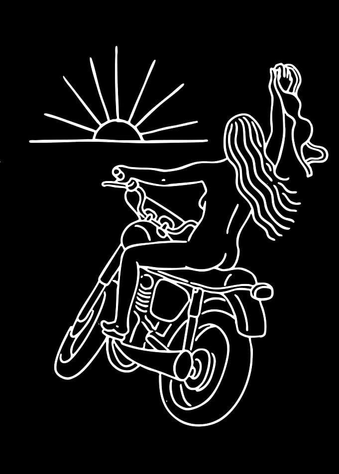 Woman riding a motorcycle at sunset
