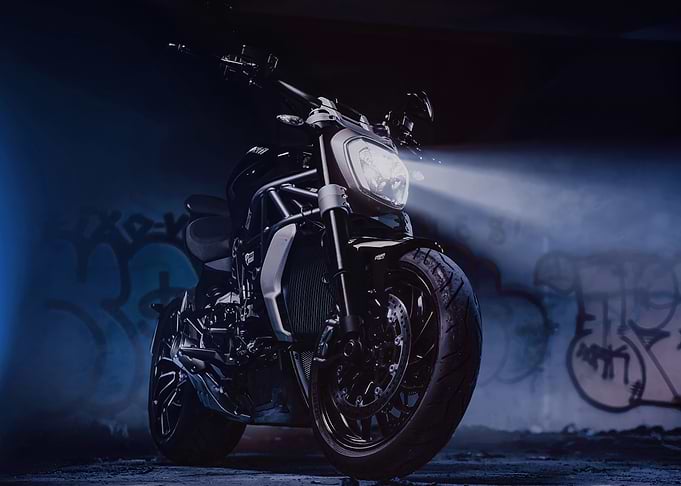 Black Motorcycle with Headlights On