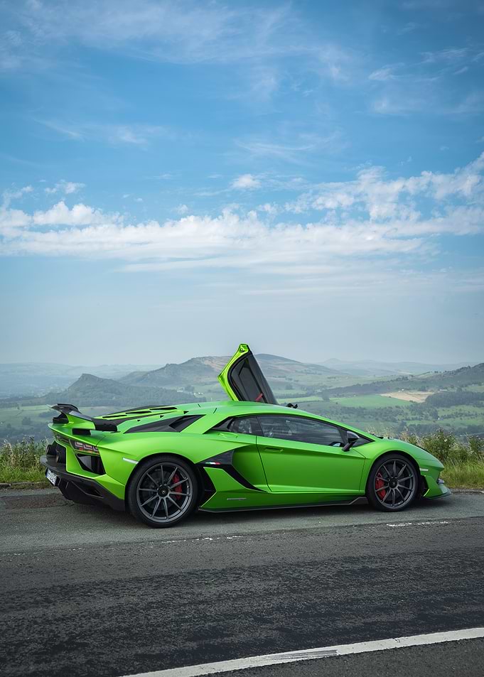 Green Lamborghini Aventador on a Scenic Road