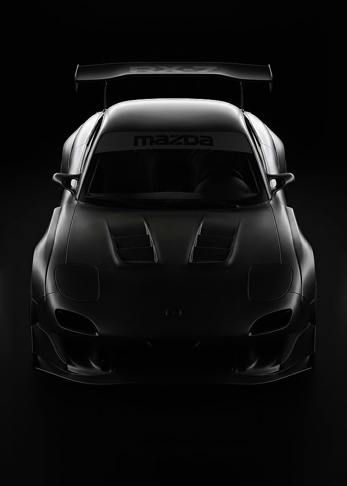 sleek black Mazda RX-7 Widebody Race Car