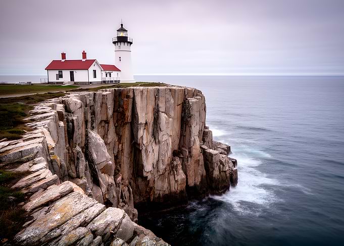 Lighthouse on a cliff overlooking the ocean