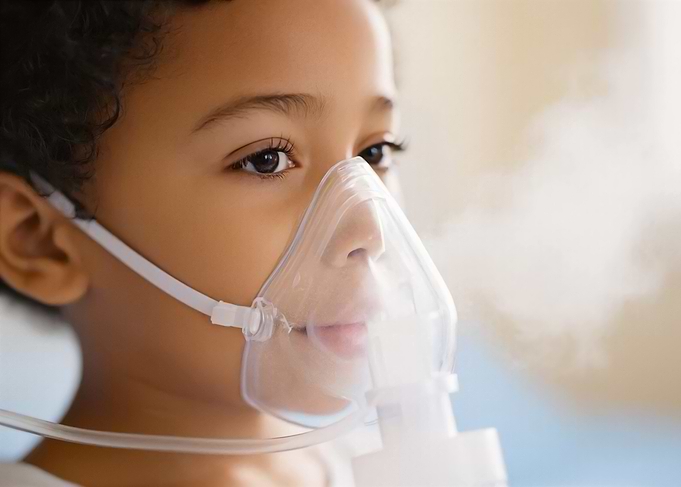 Child using a nebulizer mask