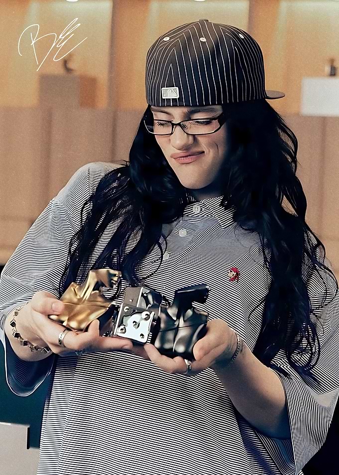 Billie Eilish gold and black figurines