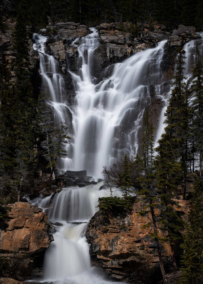 Majestic Waterfall Cascading Down Rocky Cliffs