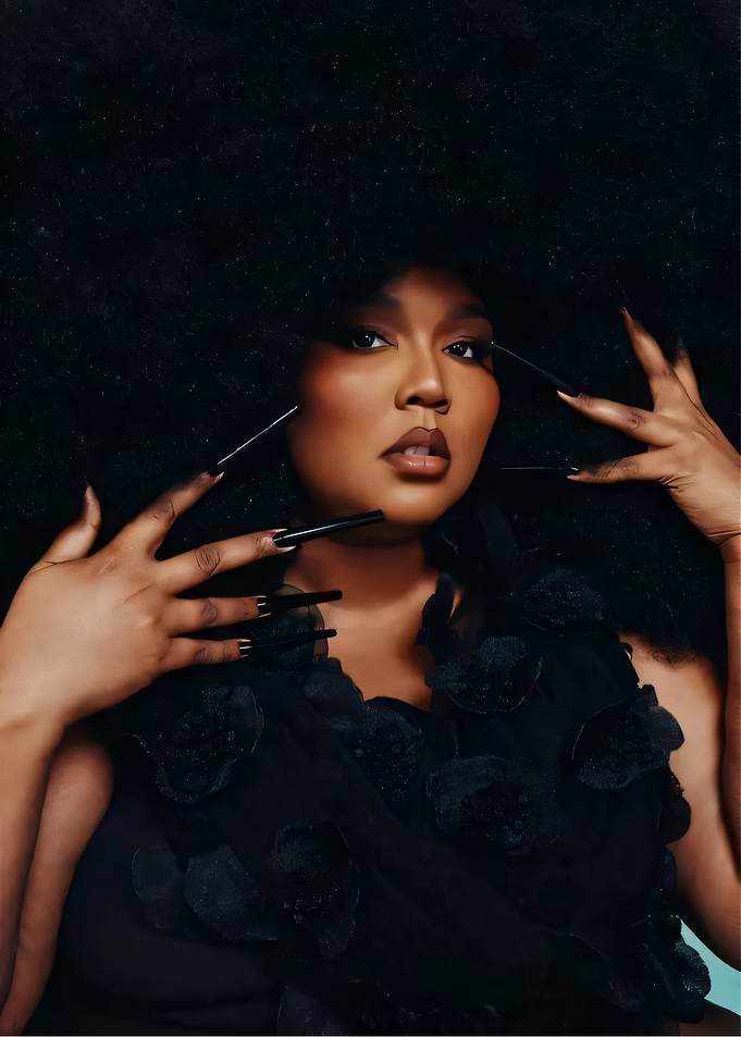 Lizzo with dramatic afro and nails