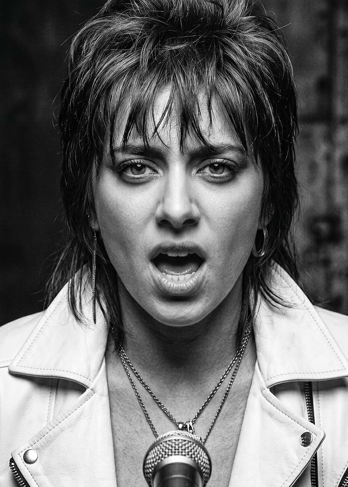 Woman singing into microphone