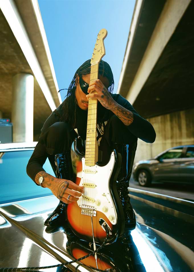 Man with Guitar Under Bridge