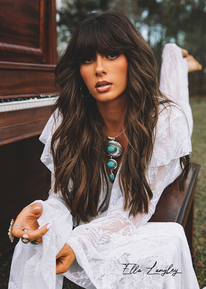 Bohemian Woman in White Lace Dress by Piano