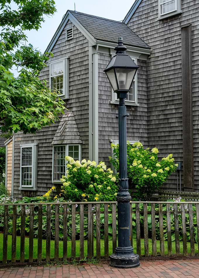 Quaint House with Lamp Post and Garden