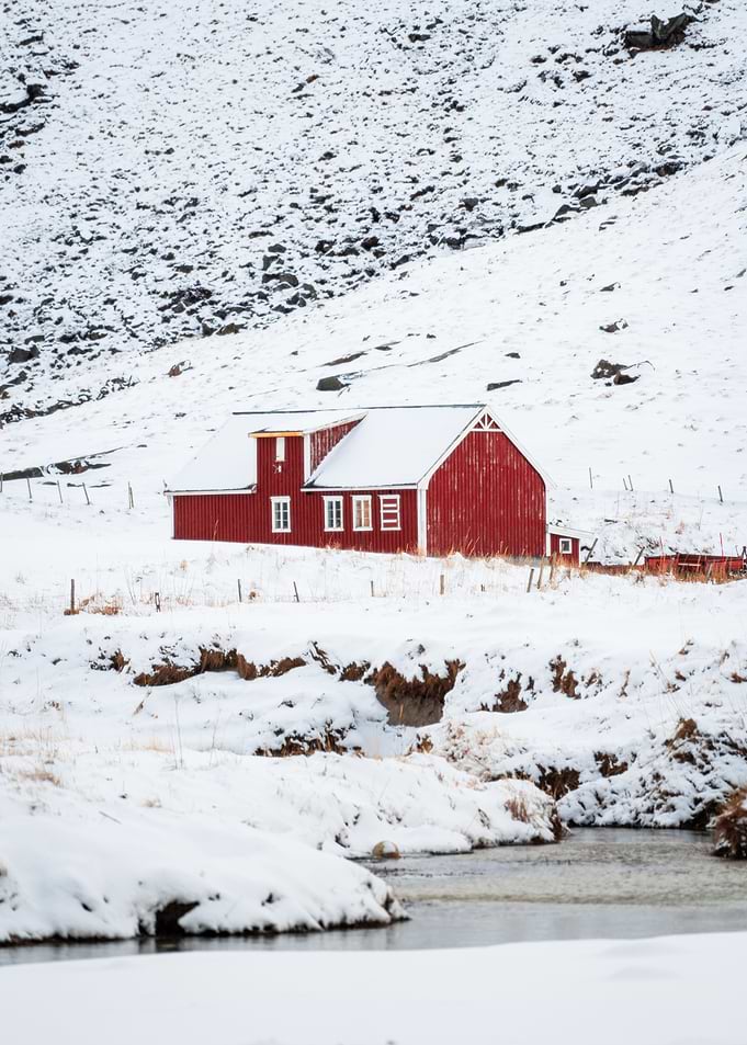 Red barn in snowy landscape