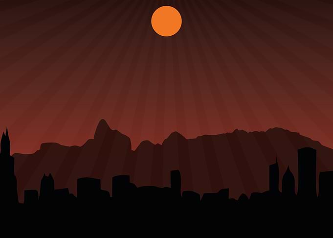 Cityscape at Sunset with Mountains