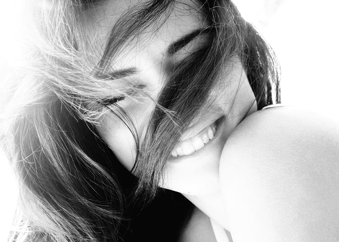 Black and White Portrait of a Smiling Adriana Lima