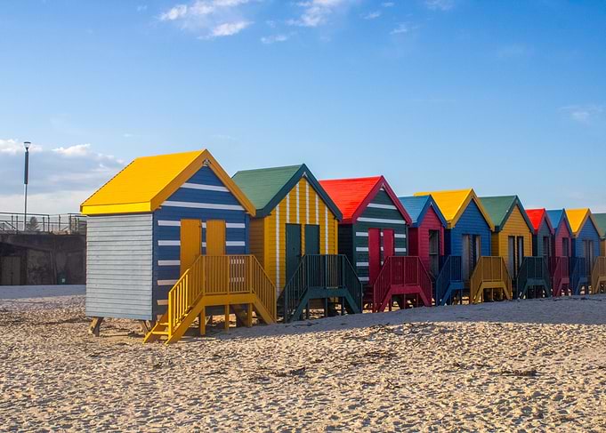Colorful Beach Huts on a Sandy Shore