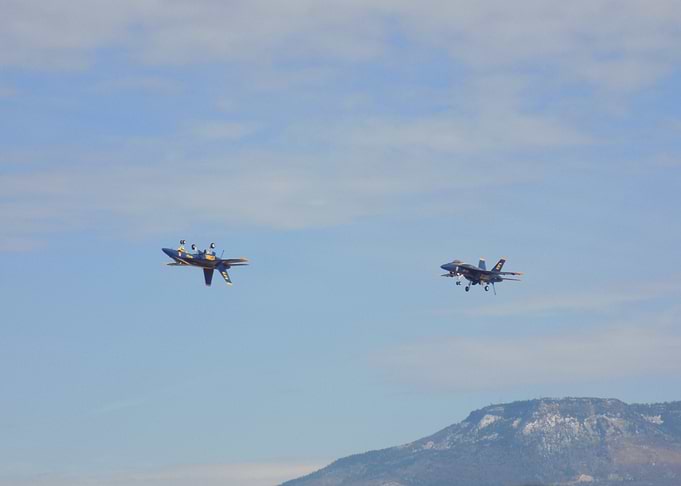 Blue Angels jets inverted with landing gear