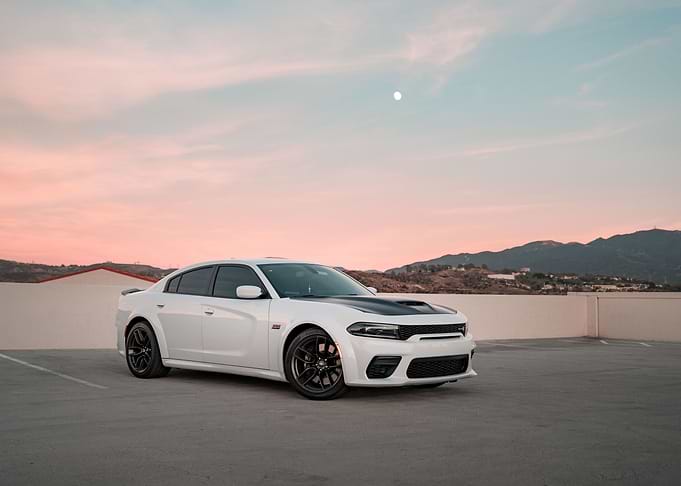 White Dodge Charger at Sunset