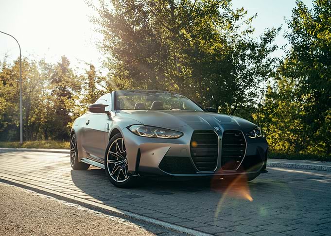Silver BMW Convertible on Paved Road
