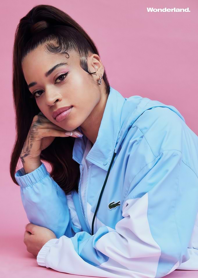 Ella Mai Poses in Lacoste Jacket