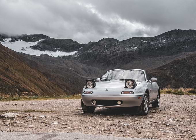 Silver Mazda Miata Convertible in Mountains