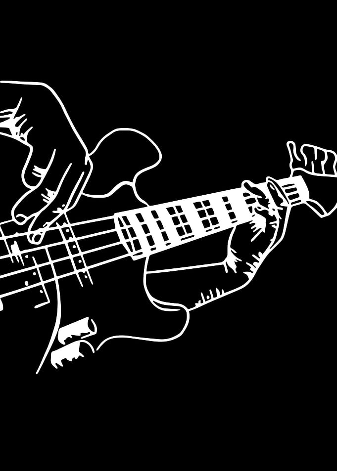 Hands playing a bass guitar