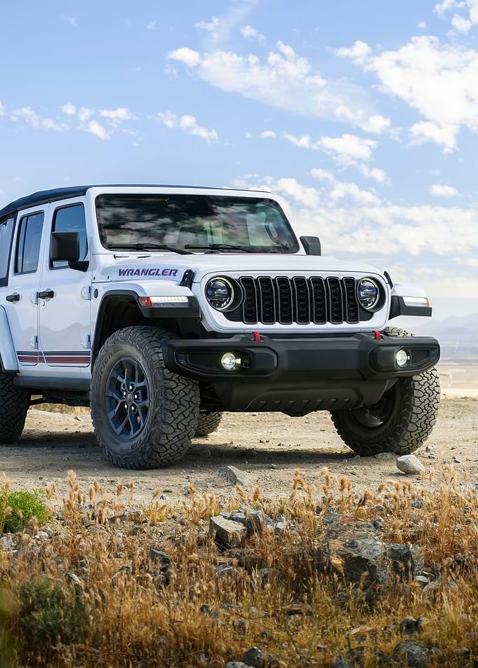 White Jeep Wrangler in Desert Landscape
