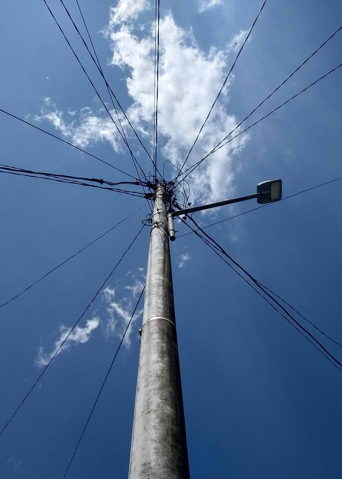Utility Pole Against Blue Sky