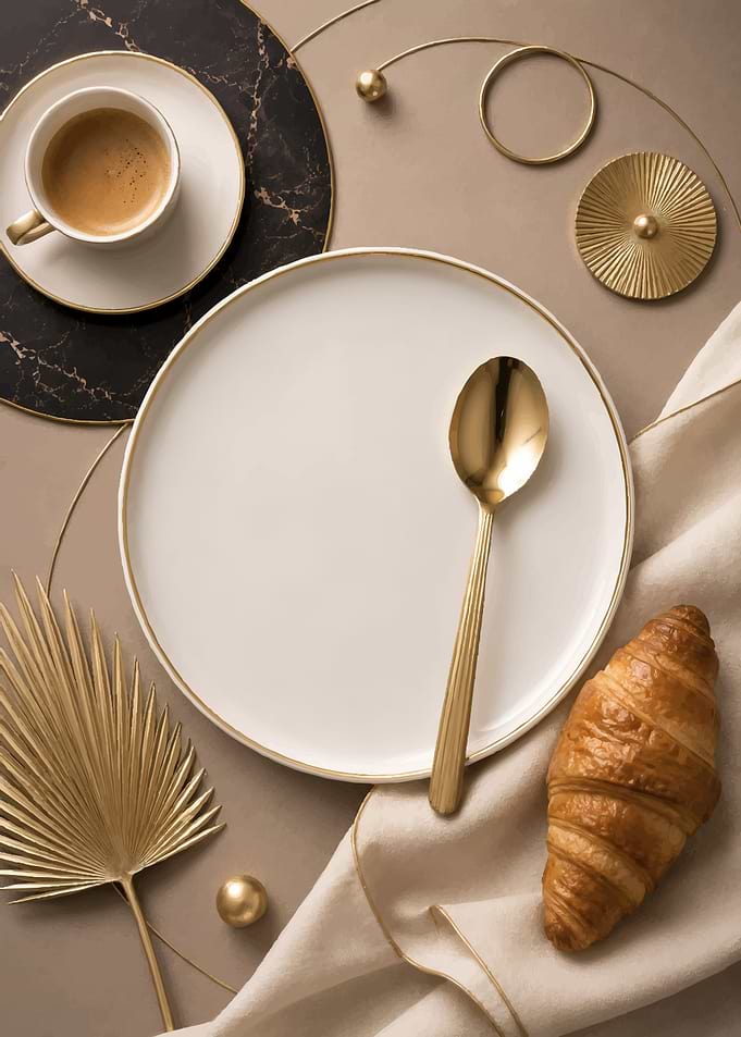 Elegant breakfast setting with coffee and croissant