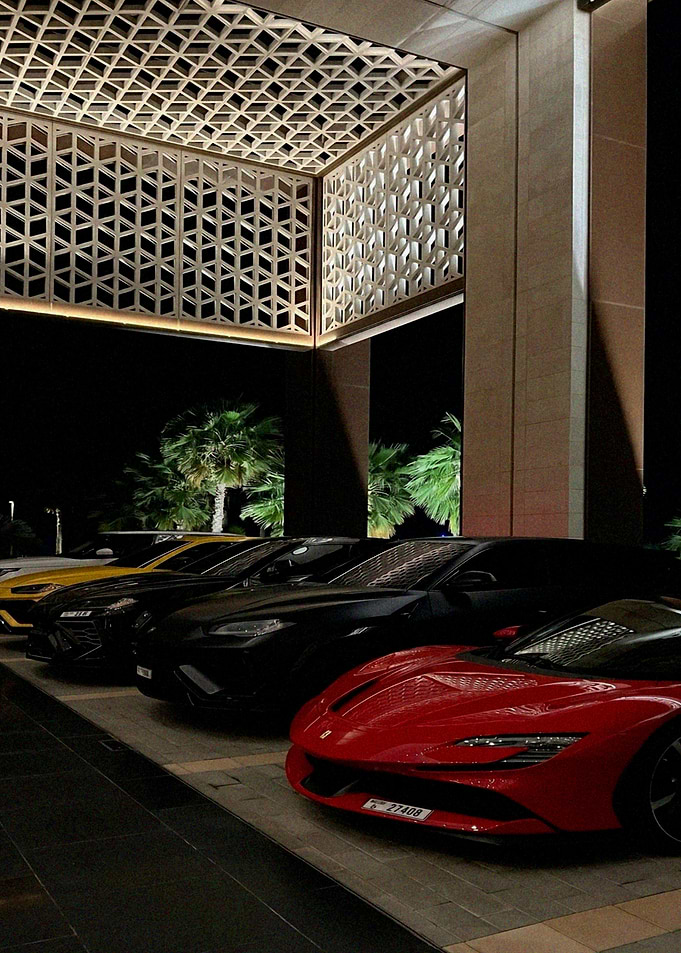 Luxury Cars Lined Up at Night