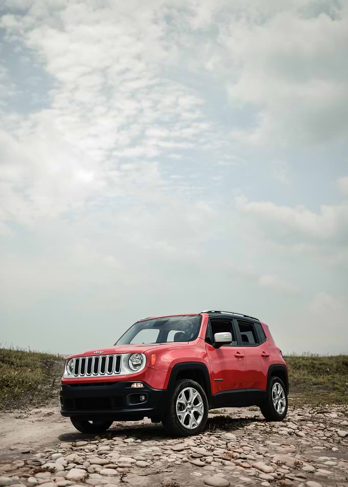 Red Jeep Renegade on a Rocky Path