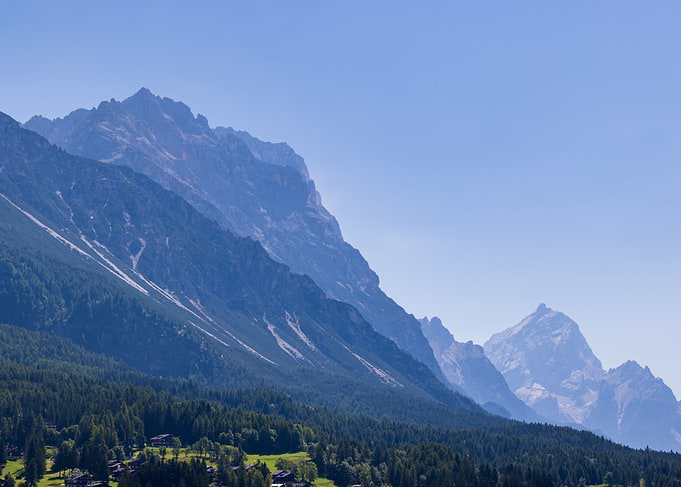 Majestic Mountain Range Under Clear Blue Sky - Dolomites in Italy