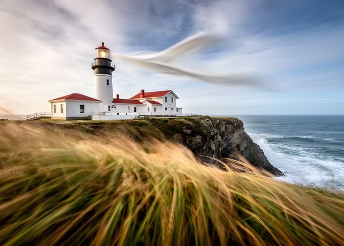 Lighthouse on a cliff overlooking the ocean