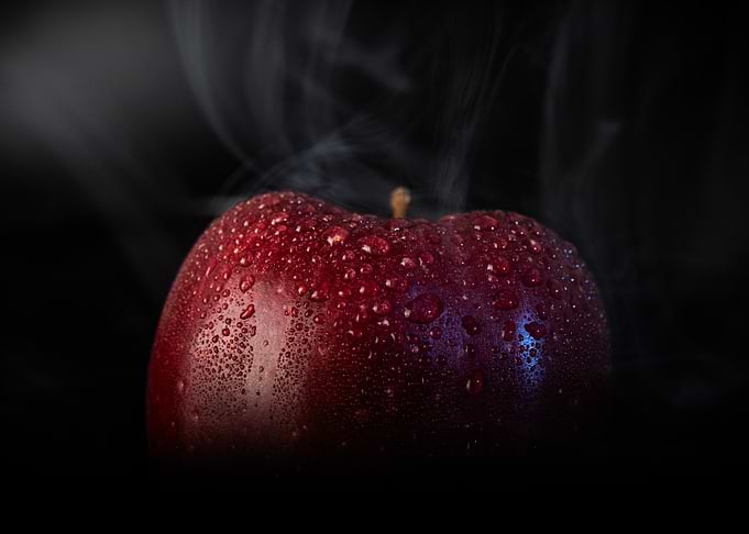 Steaming Red Apple with Water Droplets