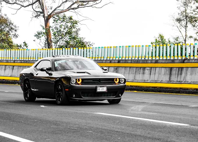 Black Dodge Challenger on a Highway