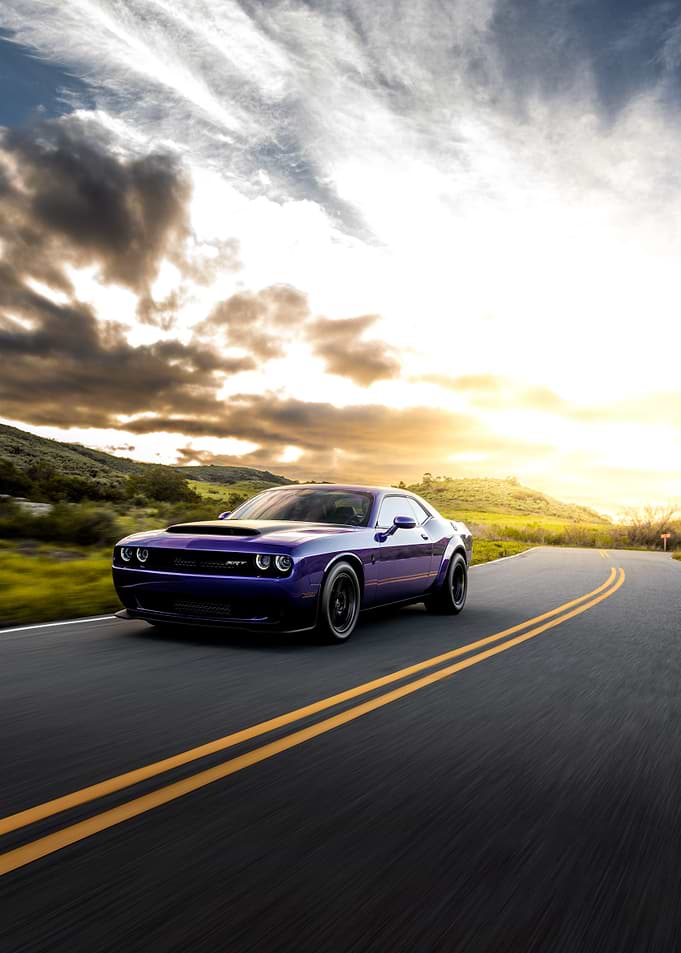 Purple Dodge Challenger SRT on a Winding Road