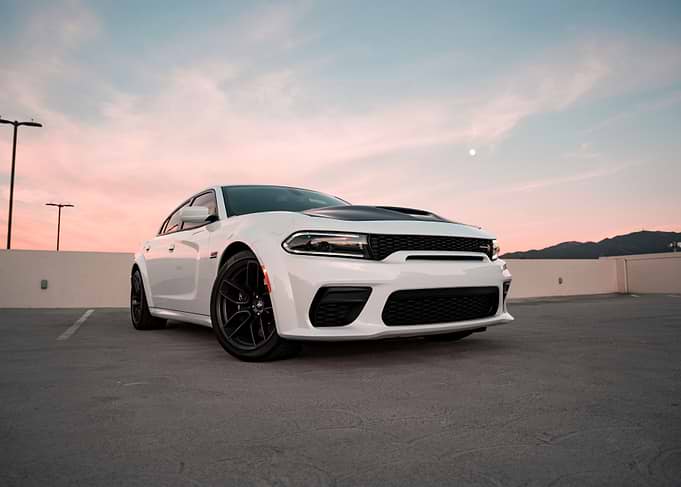 White Dodge Charger in Parking Lot