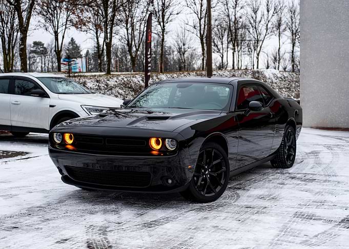 Black Dodge Challenger in Snow